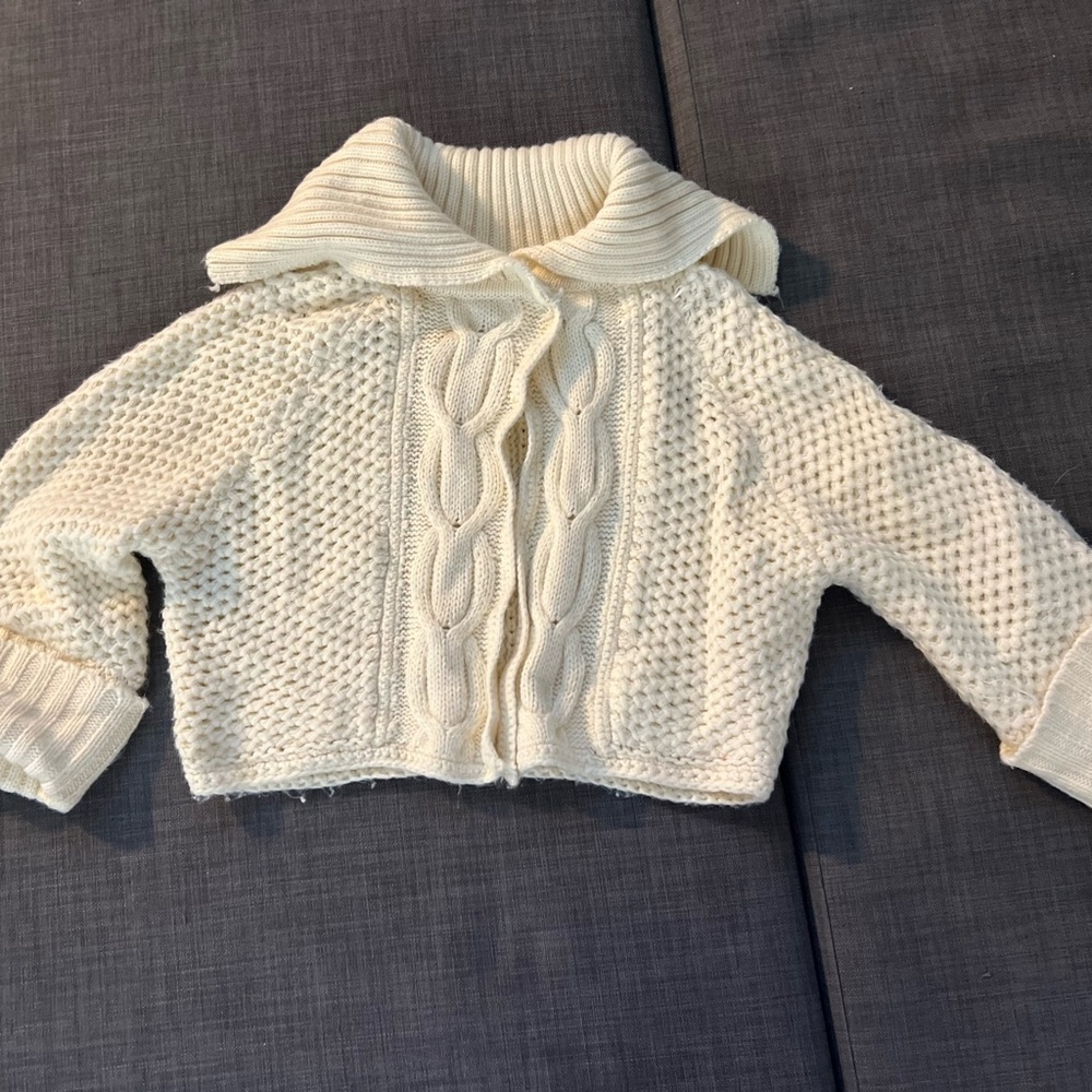 Cream knit cardigan with unique design
